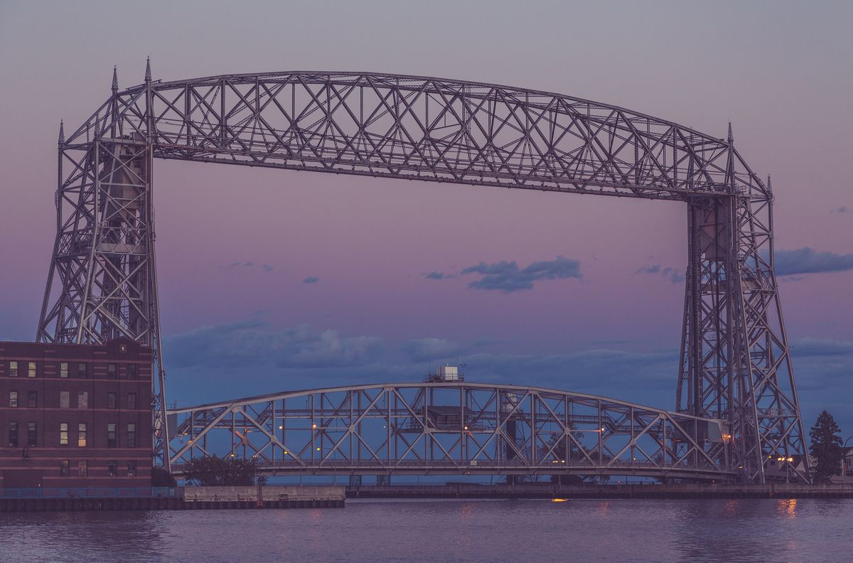Duluth&rsquo;s Aerial Lift Bridge at dusk under a soft pink sky
